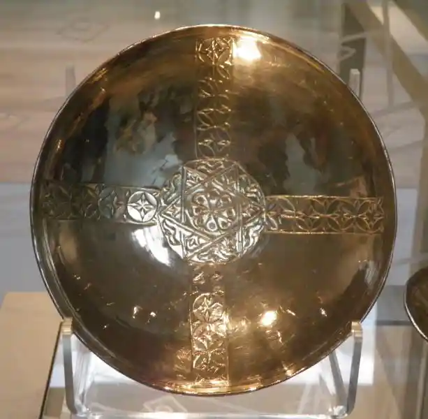Silver bowl with a cross and a solar disc